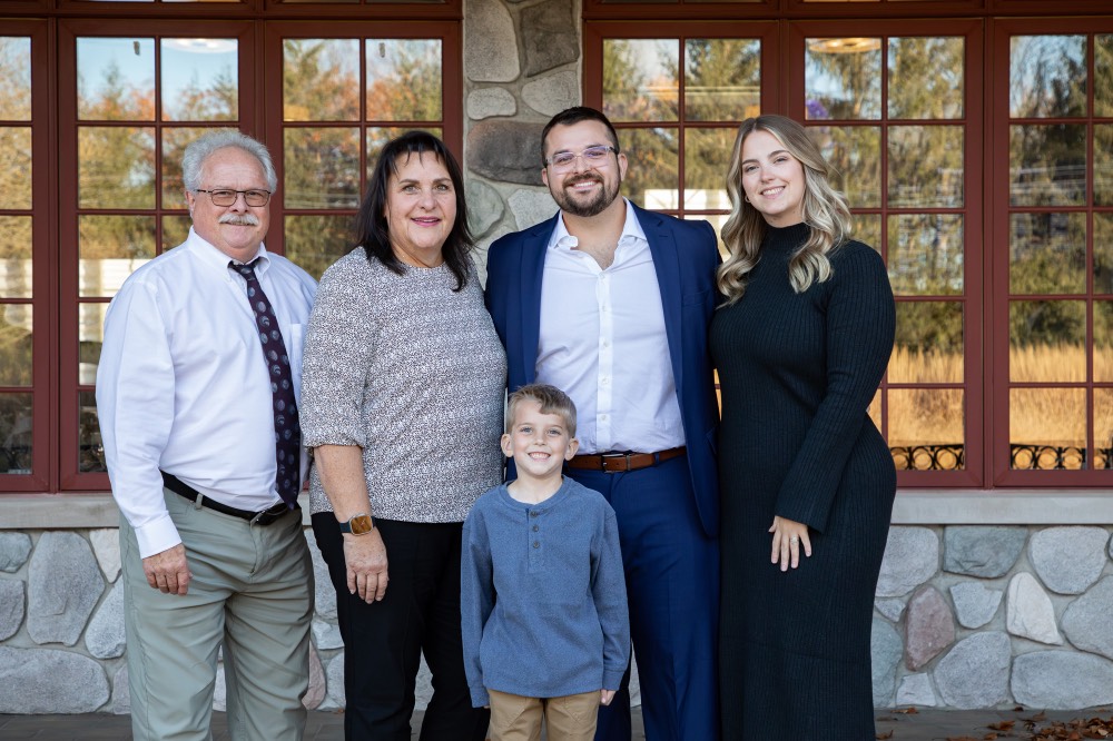 Alex Hogarth poses with family